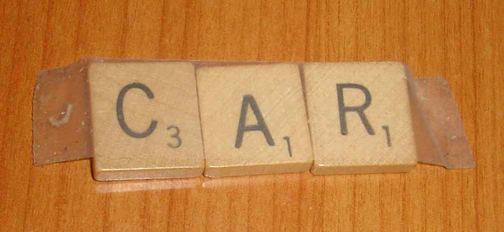 Scrabble tiles spelling the word CAR